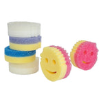 Assortment of round smile-face Scrub Mommy sponges in different colors, shown stacked and standing on a white background.
