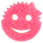 Close-up of pink textured Scrub Mommy scrubber side shaped like a smiling face