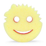 Front view of a yellow FlexTexture Scrub Mommy sponge with spiky outer edge and smile-face cutouts.