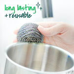Hand holding a stainless steel scrubber over a metal pot with text claiming 'long lasting + reusable'