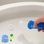 Hand holding blue applicator stamping a clear gel disc onto the inside rim of a toilet bowl