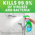 Hand spraying Scrubbing Bubbles Rainshower cleaner toward a showerhead with large text about killing 99.9% of viruses and bacteria