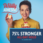 Smiling woman holding apple pieces with overlaid claim text stating ‘75% Stronger All-Day Hold’ and ‘Wildly Adhesive’