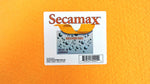 Close-up of a Secamax product label on textured orange shammy material, showing brand name, droplets graphic and barcode.