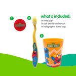Flat-lay of Sesame Street toothbrush kit pieces: red holographic travel cap, yellow soft-bristle toothbrush, and orange rinse cup with character art