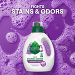 Seventh Generation lavender liquid detergent bottle centered on a purple soapy background with 'Fights Stains & Odors' text