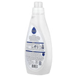 Rear view of a white Seventh Generation fabric softener bottle showing ingredient and usage text on the backside label