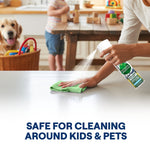 Lifestyle image of a person spraying Seventh Generation Ultra Deep cleaner on a countertop while wiping