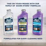 Three Shark HYDRO formula bottles including Hard Wood concentrate displayed together on a counter.