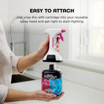 Person detaching StainForce spray head above a Shark refill cartridge on a bright kitchen counter with attachment instructions text.