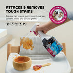 Hand-held Shark StainForce spray treating a highchair cushion with food stain graphics and text about removing tough stains.