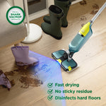 Shark VacMop cleaning a muddy footprint on a hardwood floor with callouts for fast drying and disinfecting.
