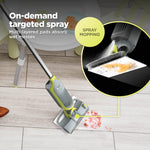 Shark VACMOP spraying cleaner onto a pad with inset showing spray mopping concept and multi-layered pad absorbency