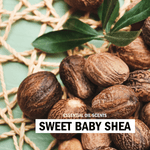 Close-up photo of shea nuts arranged on woven mat with 'Sweet Baby Shea' label overlay