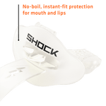Angled close-up of a white Shock Doctor Bolt lip guard showing SHOCK logo and ventilation features with orange caption