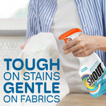 Person spraying a stained white shirt with a Shout Free bottle and overlay text 'TOUGH ON STAINS GENTLE ON FABRICS'
