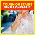 Image of a child eating a popsicle with a stained dress and text ‘Tough on stains gentle on fabric’ above