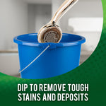 Shower head being dipped into a blue bucket with overlay text instructing to dip to remove tough stains and deposits