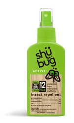 Close-up of a bright green Shübug Active insect repellent pump bottle with label and clear spray cap.