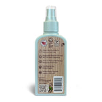 Rear view of shübug blue spray bottle showing back label with icons, usage text, barcode and QR code