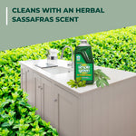 Simple Green bottle staged on a kitchen counter with leafy background and text about a herbal sassafras scent