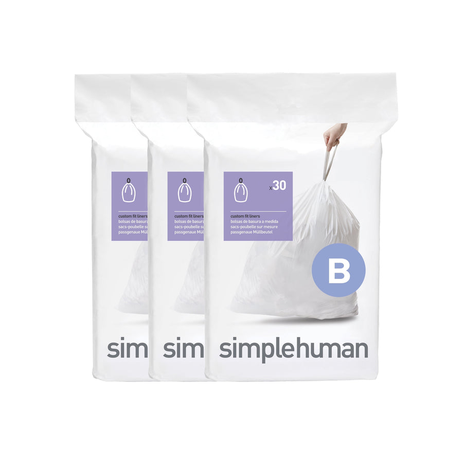 Three white simplehuman Code B trash bag packages shown side-by-side with a large B badge on the front.