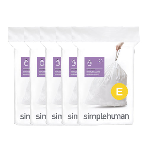 Five stacked simplehuman dispenser packs showing a white trash bag with a yellow E size badge and branded packaging
