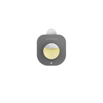 Single simplehuman Odorsorb pod in gray with a yellow circular center on white background