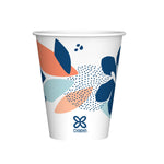 Single Dixie paper cup with blue and coral leaf pattern on white background