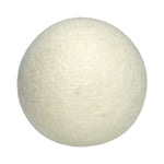 Close-up top-down view of a single off-white felted wool dryer ball on a white background
