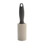 Single gray-handled lint roller upright on white background showing full handle and roll