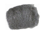 Close-up of a single gray medium-fine steel wool pad showing fibrous metallic strands and irregular edges
