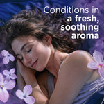 Woman sleeping peacefully on a purple surface surrounded by lavender blossoms, advertising soothing aroma