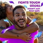 Outdoor lifestyle photo of a smiling couple with overlay text 'Fights tough odors' and floating blue and purple petal graphics