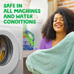 Smiling person holding a towel near a washing machine with a Gain Relax bottle visible in the background and text 'Safe in all machines and water conditions'.