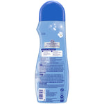 Rear view of a light blue Snuggle Blue Sparkle bottle showing usage instructions, warning text, and a blue cap on a white background.