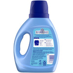 Rear view of a blue Snuggle SuperFresh liquid fabric softener bottle showing directions, warnings, and barcode