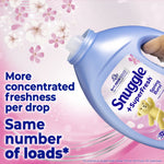 Tilted blue Snuggle SuperFresh bottle being poured against a pink floral background with text about concentrated freshness per drop.