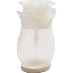 Translucent Soap Daddy dispenser angled to show flower-shaped top and embossed logo on body