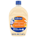 Softsoap milk & honey refill bottle with orange label and blue cap on white background