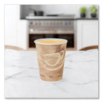 Brown polycoated hot paper cup filled with a light-colored beverage on a marble surface with a blurred kitchen background