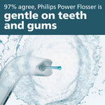Close-up marketing image of a Sonicare flosser tip spraying water with claim text about being gentle on teeth and gums.