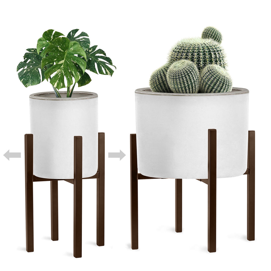 Two brown mid-century metal plant stands shown at different widths holding white planters with greenery on a white background.