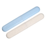 Two cylindrical toothbrush travel cases in speckled blue and beige, shown flat on white background