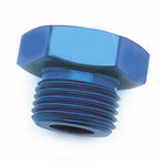 Macro view of a blue anodized threaded plug with hexagonal head on a white background