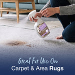 Close-up of hands spraying Bona Pet System cleaner onto a stained carpet, text says 'Great For Use On Carpet & Area Rugs'.