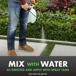 Person applying product with a handheld spray tank along a lawn edge, text below instructs to mix with water