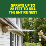 Hand spraying a Raid Defend can toward a large wasp nest on a house eave with text about spraying up to 22 feet