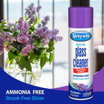 Sprayway glass cleaner can with purple cap placed next to a vase of lilacs, promotional ammonia-free callout at bottom.