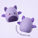 Two views of a purple bat-themed Squish cap accessory for the Ordo kids toothbrush, front and back